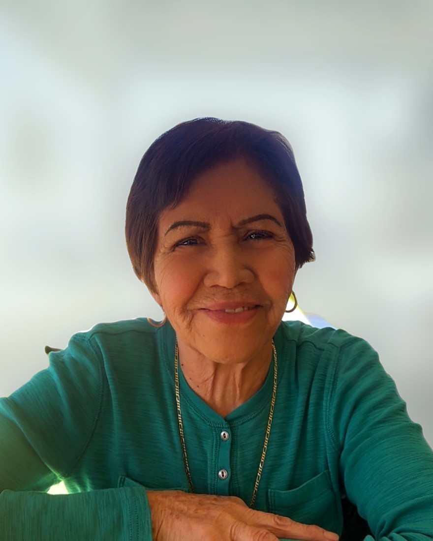 Netty's mother, smiling warmly — the heart behind Personal Touch Home Care